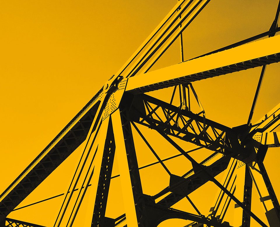A large metal support structured, tinted with CELO's signature yellow